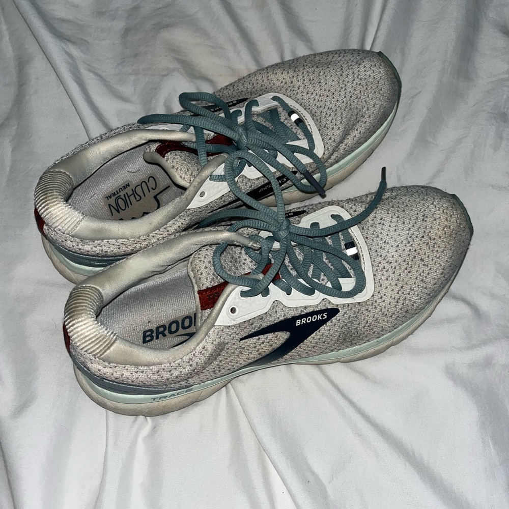 white and blue brooks